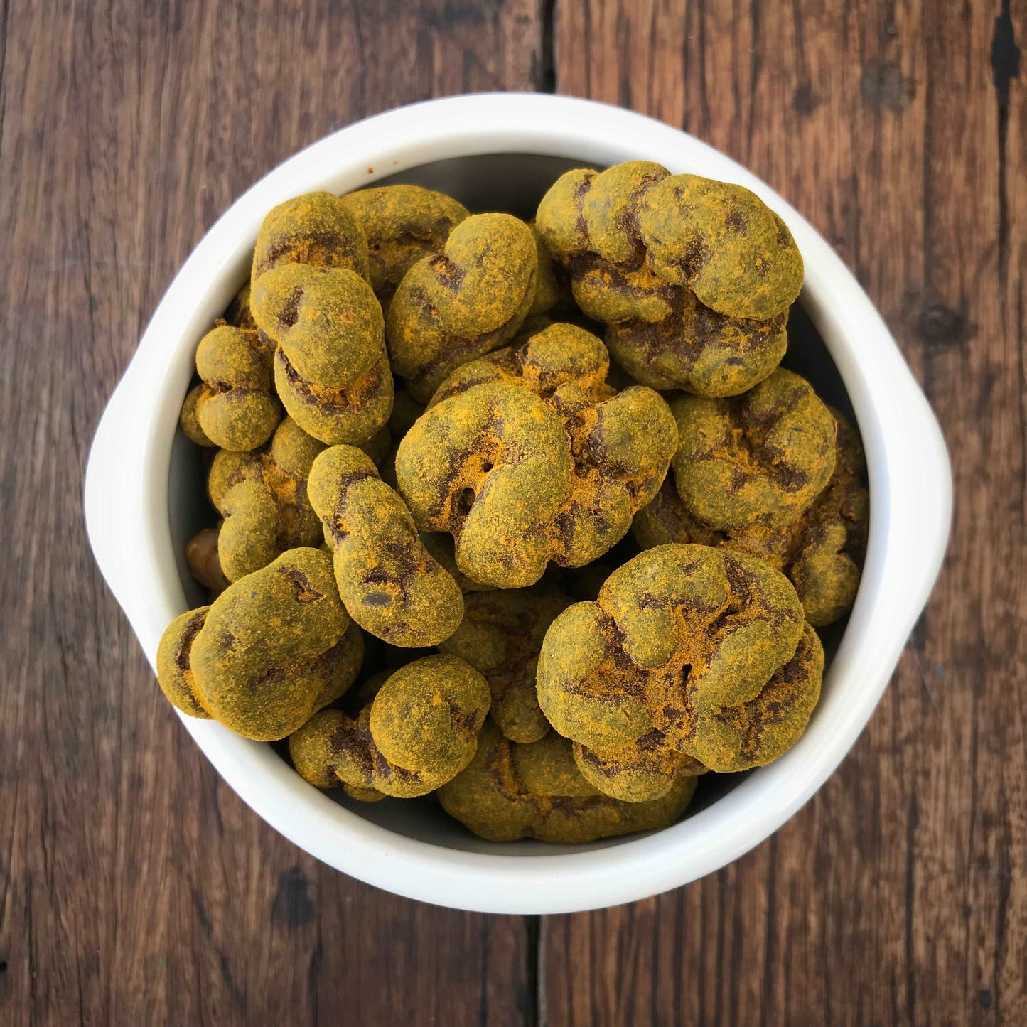 Dark Chocolate Coated Walnuts with Turmeric  100% Australian grown Walnuts, dry roasted, smothered in couverture dark chocolate 53% and then dusted with delicious turmeric powder.